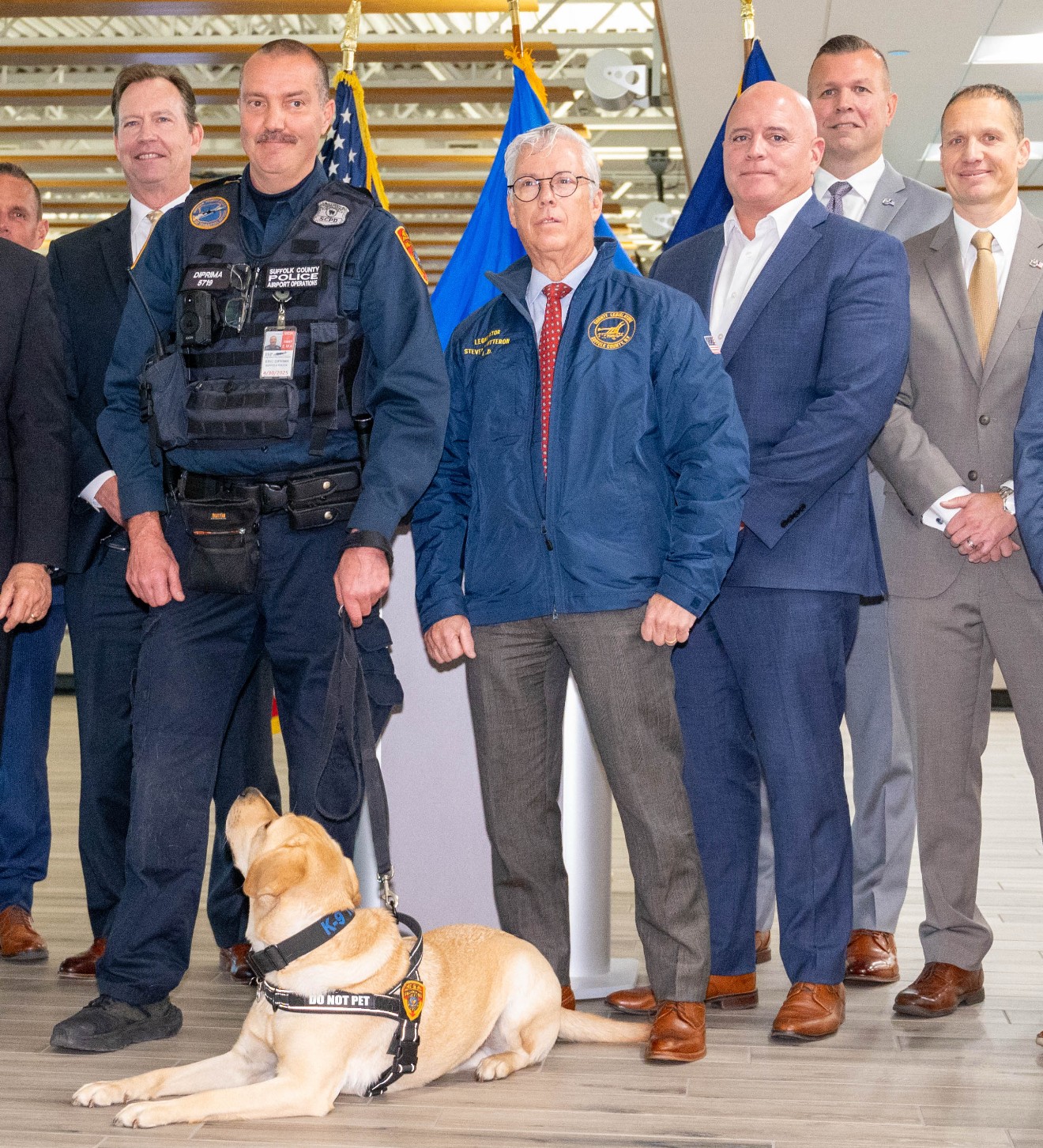 Security dog with TSA Agent and Officials